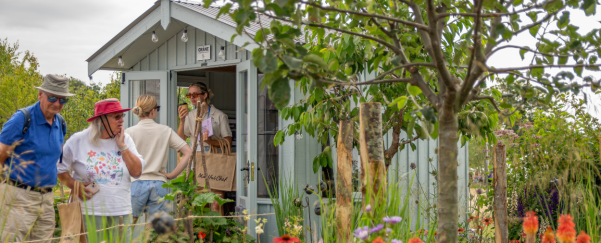 Visitors leaving the Ickworth Summerhouse and admiring the garden